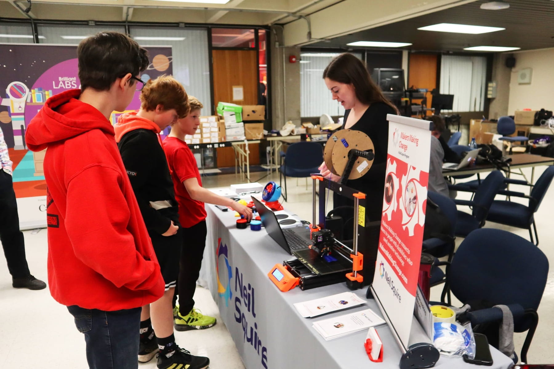Kids talking to a presenter at a previous fair