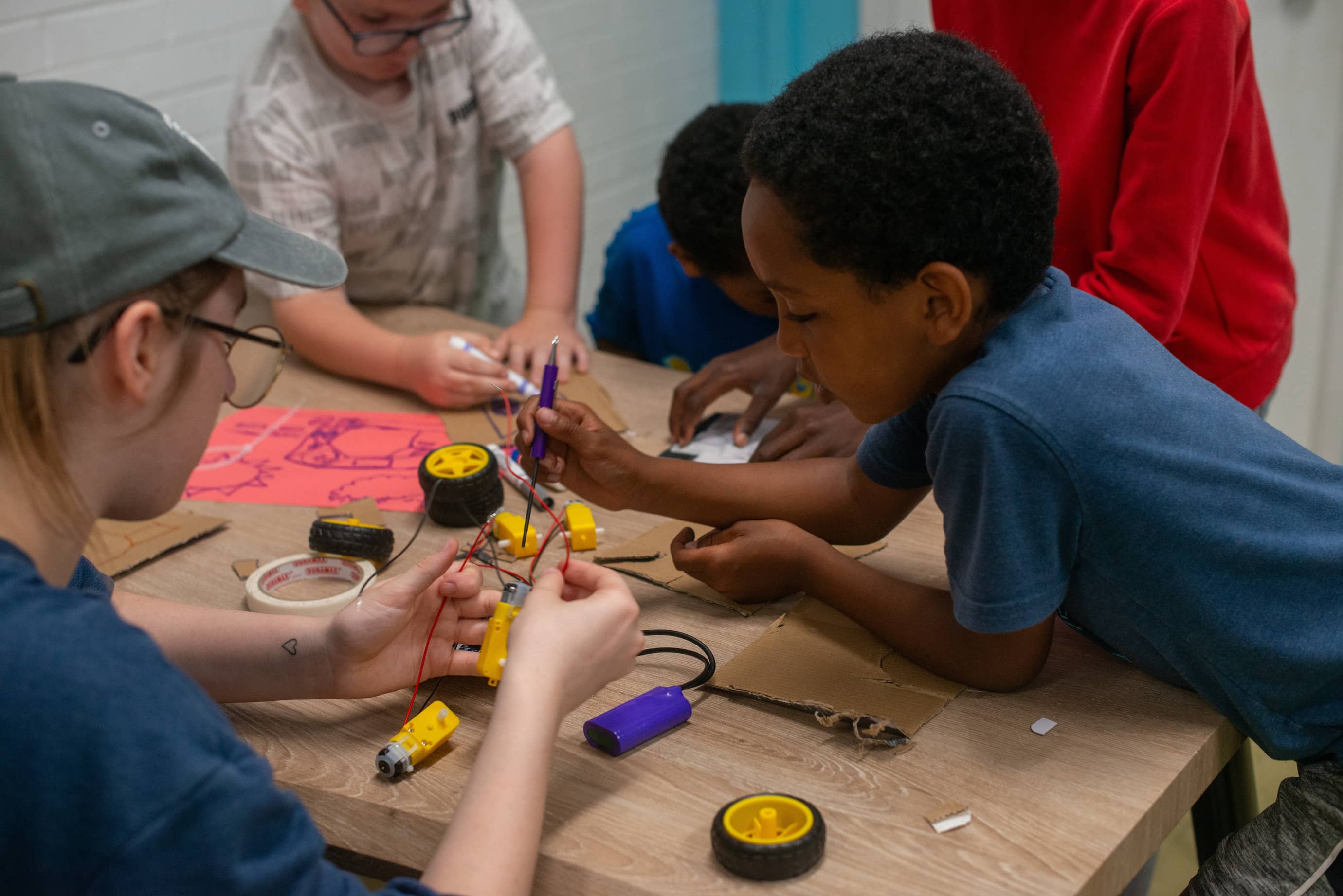 Students assembling a robot