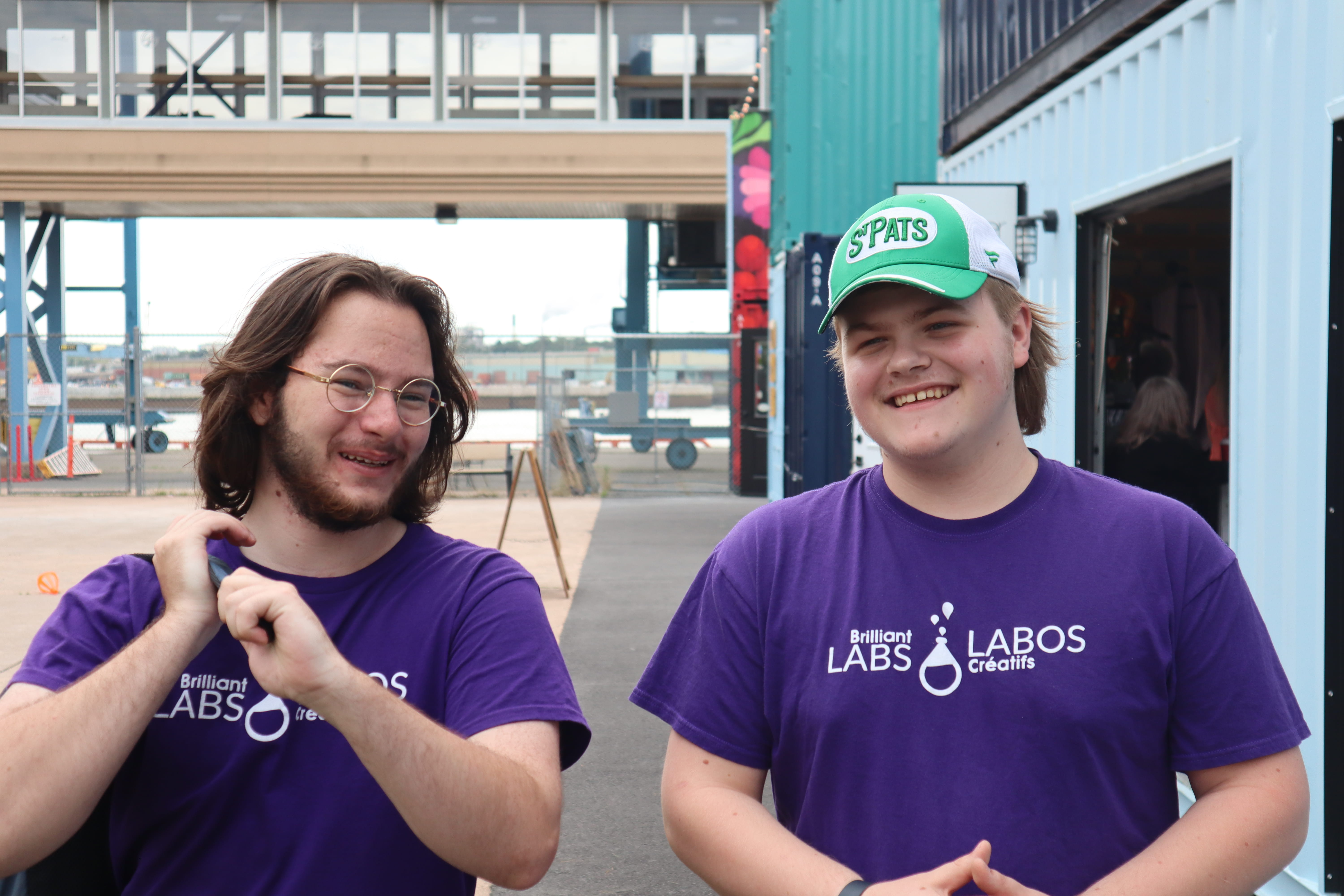 Two Brilliant Labs STEAM mentors sitting by the Saint John River in Saint John