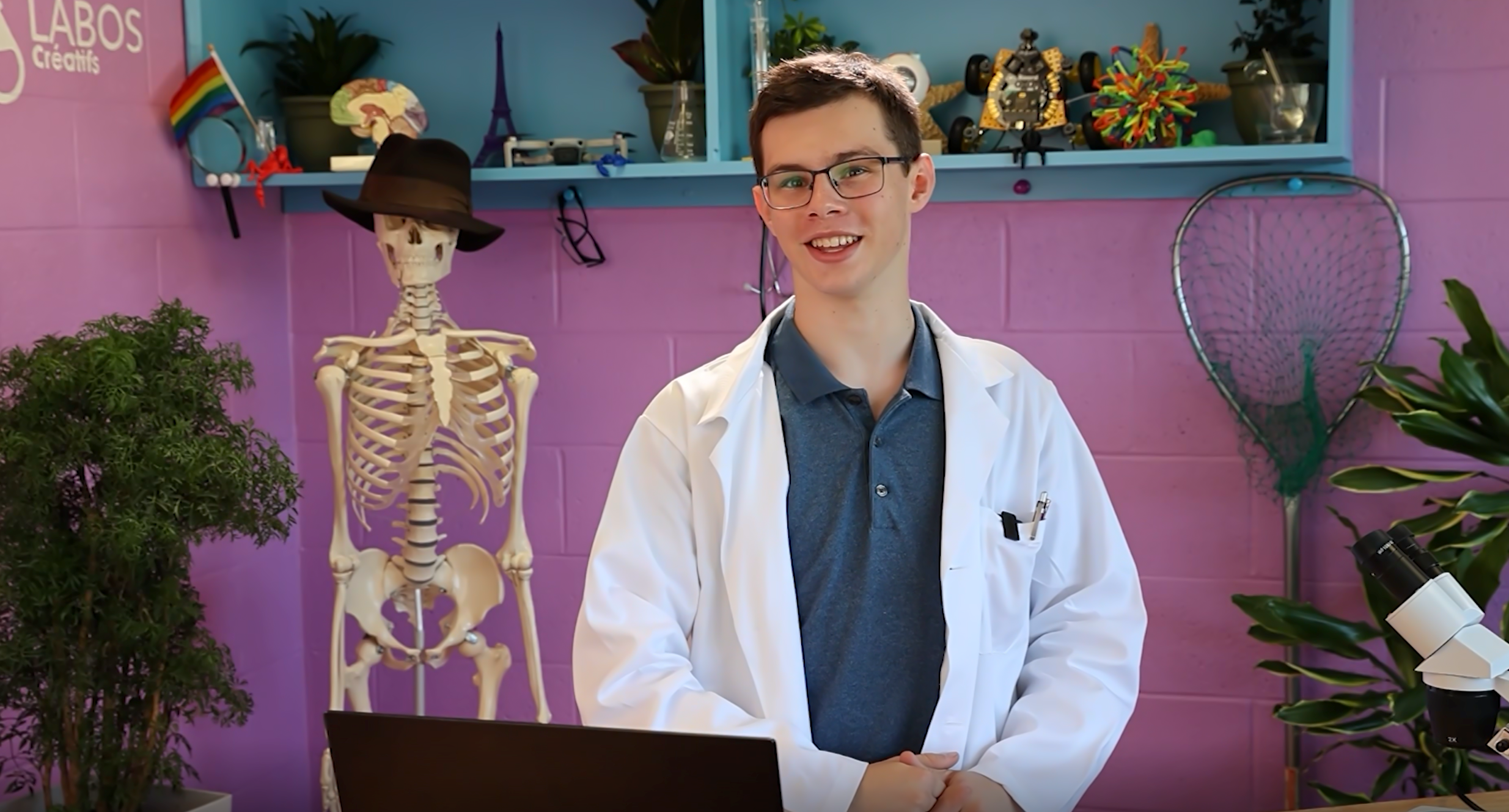 Ian, a Brilliant Labs Alumni, standing in the lab